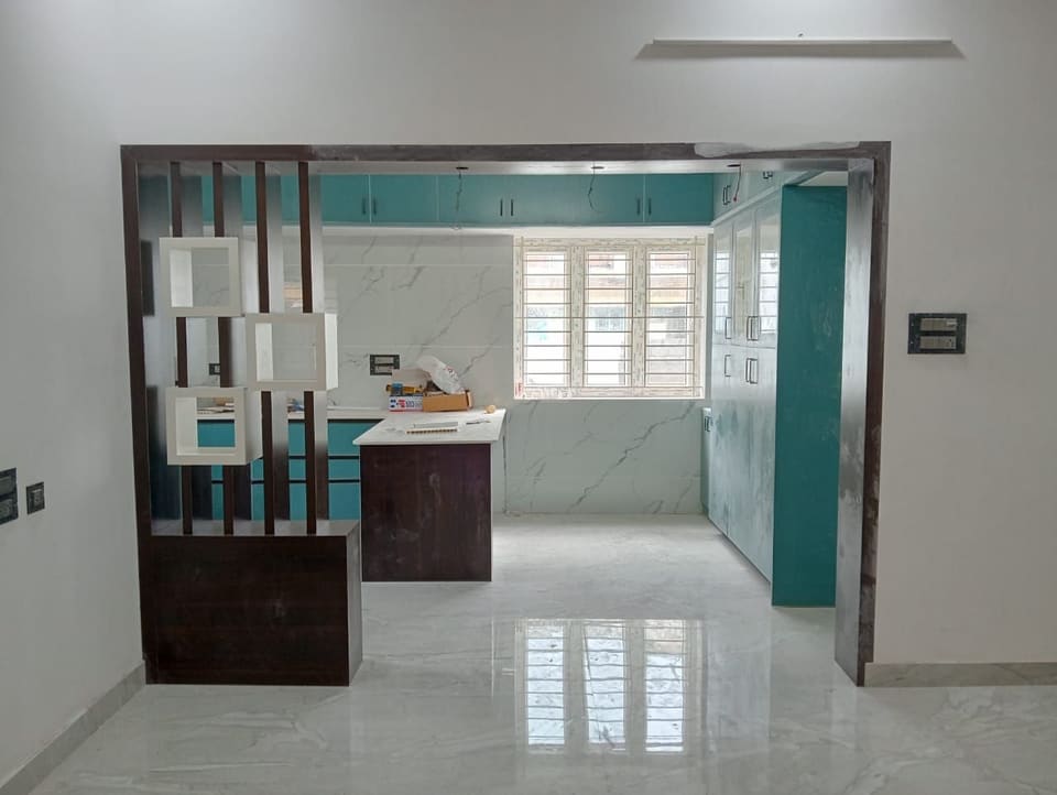 Room partition with open display shelving between living and dining areas