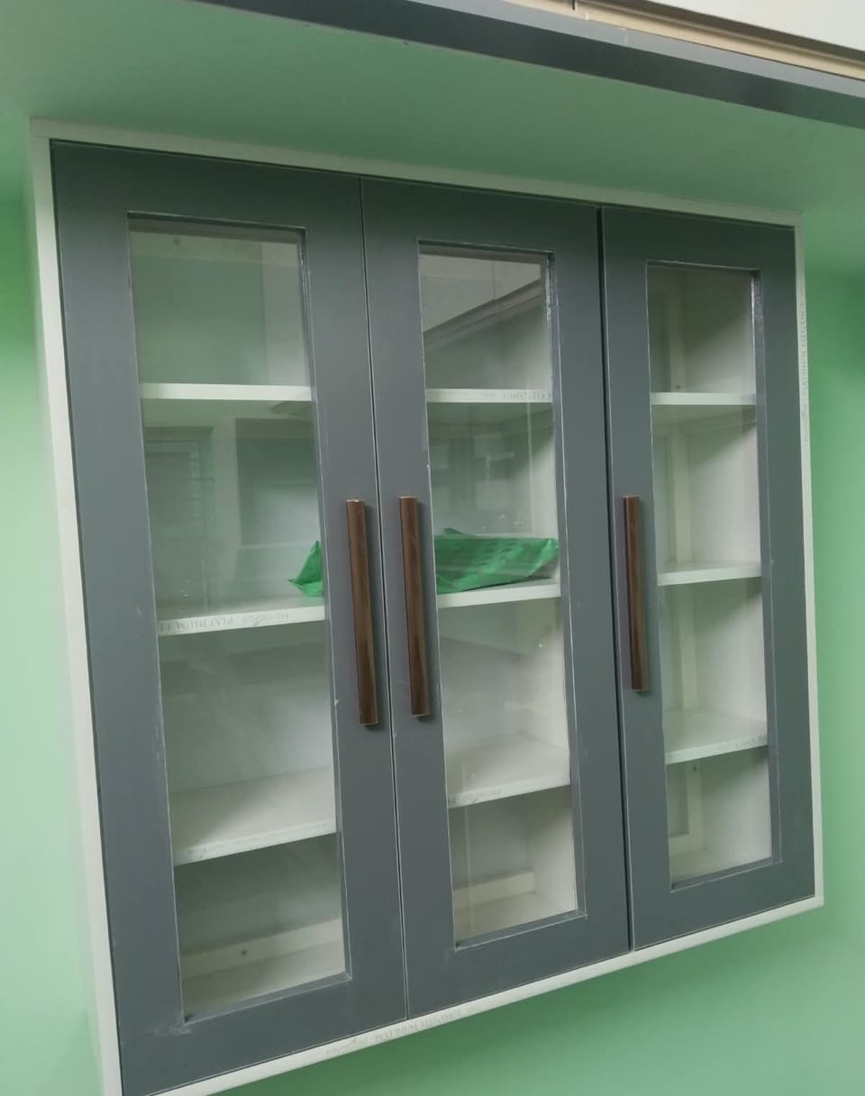Grey PVC wall cupboard with glass shutters and wooden handles